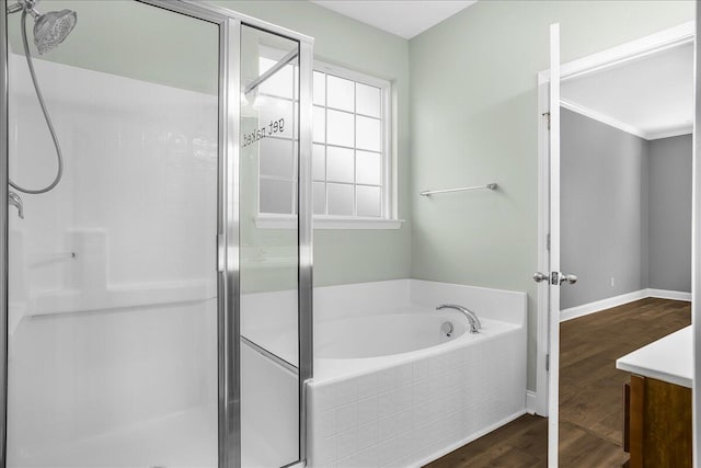 bathroom with plus walk in shower and wood-type flooring