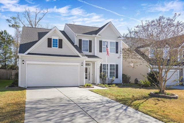 view of front of property featuring a front lawn and a garage