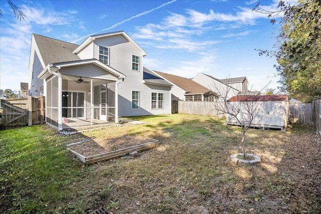 rear view of house with a lawn, a patio area, and ceiling fan