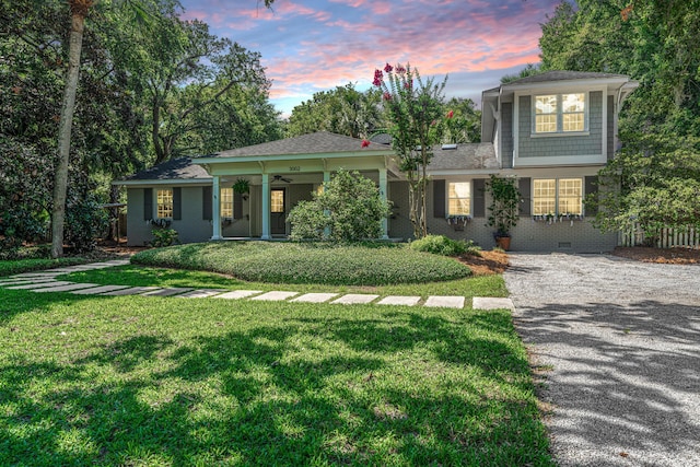 3002 Waterway Blvd, Isle Of Palms, SC 29451 - view of front of house with a front lawn, crawl space, driveway, brick siding, and ceiling fan