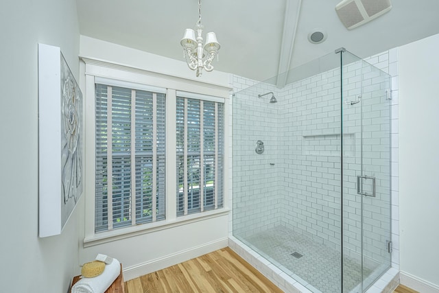3002 Waterway Blvd, Isle Of Palms, SC 29451 - bathroom with a stall shower, a chandelier, wood finished floors, and beamed ceiling