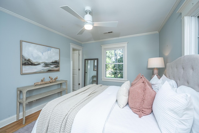 3002 Waterway Blvd, Isle Of Palms, SC 29451 - bedroom with wood finished floors, crown molding, and a ceiling fan