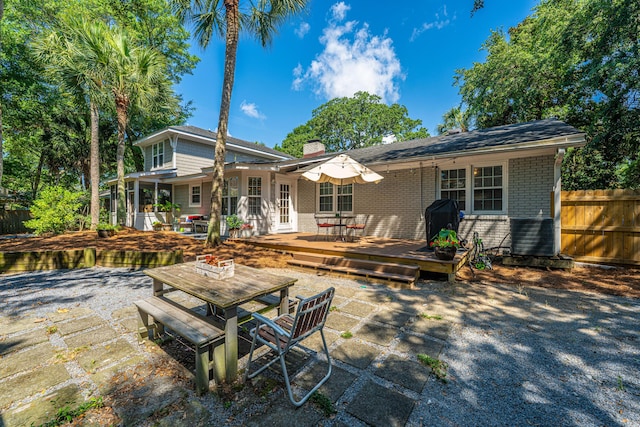 3002 Waterway Blvd, Isle Of Palms, SC 29451 - rear view of house with outdoor dining space, brick siding, a chimney, a deck, and a patio