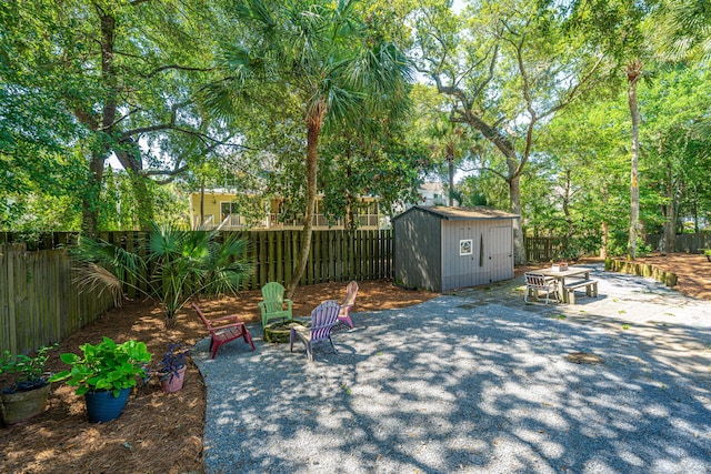3002 Waterway Blvd, Isle Of Palms, SC 29451 - fenced backyard featuring a patio area, a storage unit, and a fire pit