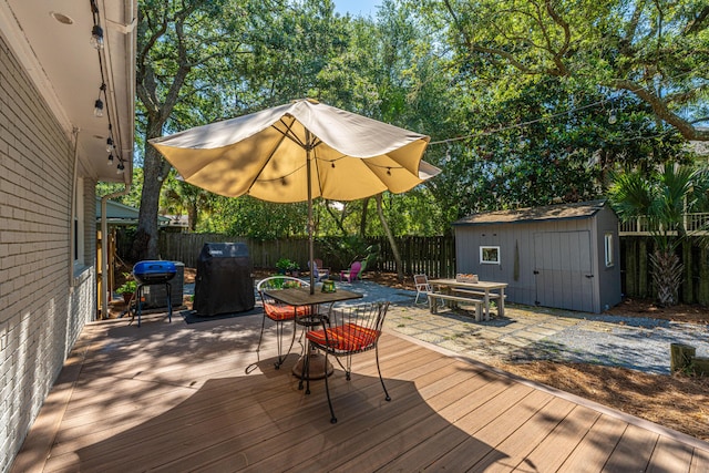 3002 Waterway Blvd, Isle Of Palms, SC 29451 - wooden terrace with outdoor dining area, a storage shed, a fenced backyard, and grilling area