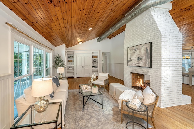3002 Waterway Blvd, Isle Of Palms, SC 29451 - living area with lofted ceiling, wood finished floors, wooden ceiling, and a brick fireplace