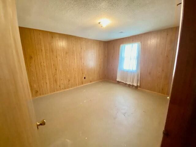 1806 S Charleston Ave, Fairfax, SC 29827 - unfurnished room featuring a textured ceiling and wooden walls