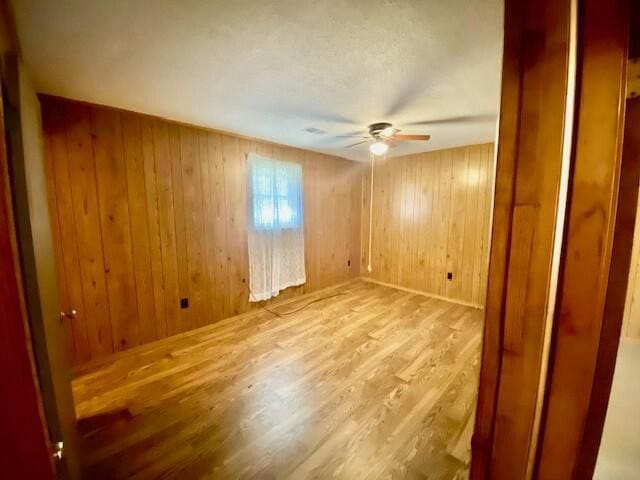 1806 S Charleston Ave, Fairfax, SC 29827 - unfurnished room with a ceiling fan, wooden walls, and wood finished floors