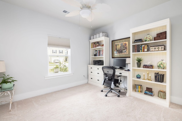 office featuring light carpet and ceiling fan