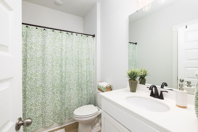 bathroom featuring hardwood / wood-style flooring, vanity, and toilet