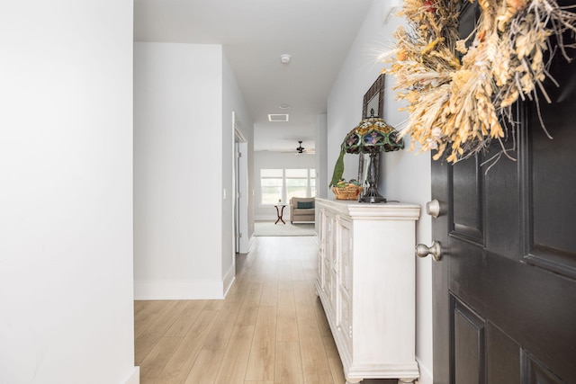 hall with light wood-type flooring