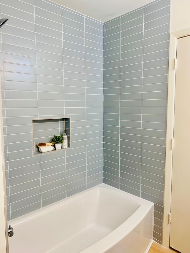 bathroom featuring shower / bathing tub combination and wood-type flooring