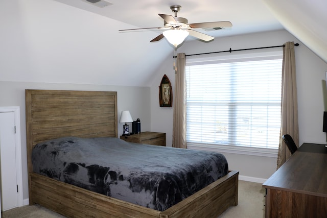 bedroom featuring multiple windows, ceiling fan, and light colored carpet