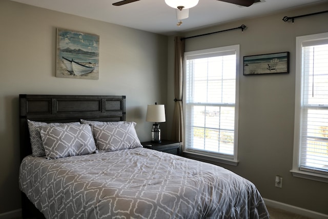 carpeted bedroom with ceiling fan