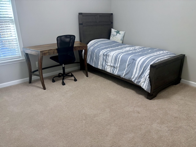 bedroom with light colored carpet