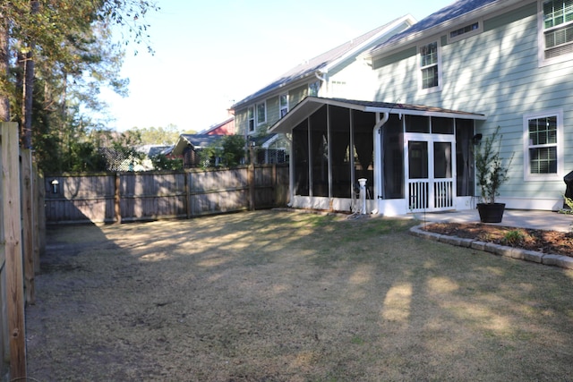 view of yard featuring a sunroom