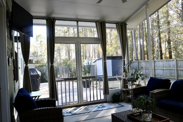 sunroom / solarium with ceiling fan and plenty of natural light