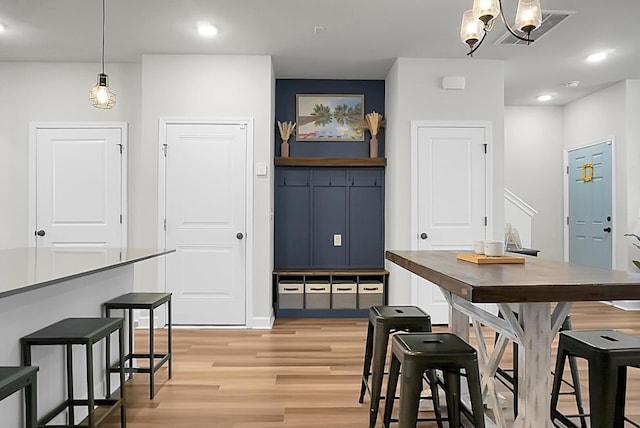 dining space with recessed lighting and light wood finished floors