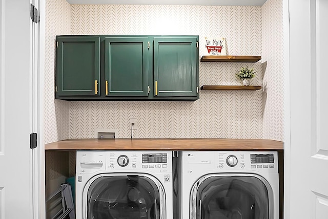 washroom with cabinet space and independent washer and dryer