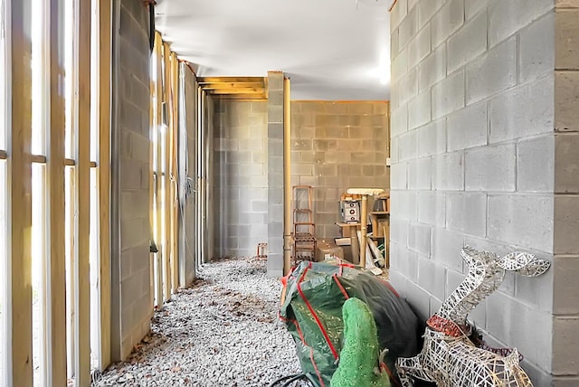 interior space with concrete block wall