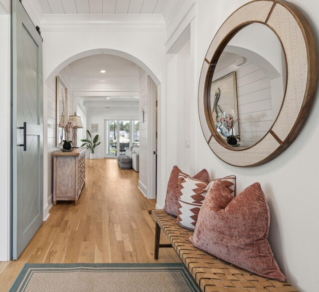 3894 Sawyers Island Dr, Mount Pleasant, SC 29466 - hallway with arched walkways, ornamental molding, and light wood-type flooring