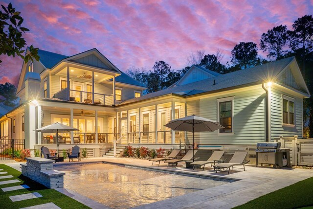 3894 Sawyers Island Dr, Mount Pleasant, SC 29466 - back of house at dusk with a balcony, ceiling fan, a patio, and fence