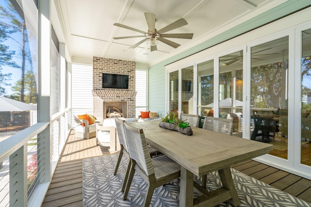 3894 Sawyers Island Dr, Mount Pleasant, SC 29466 - sunroom with a fireplace, outdoor dining space, and ceiling fan