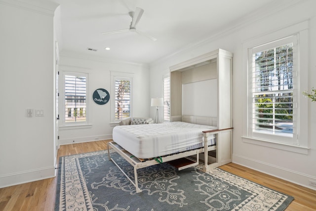 3894 Sawyers Island Dr, Mount Pleasant, SC 29466 - bedroom with crown molding, baseboards, and wood finished floors