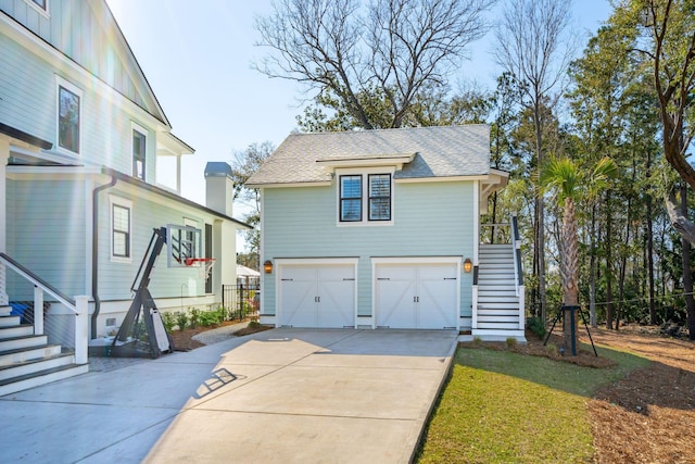 3894 Sawyers Island Dr, Mount Pleasant, SC 29466 - view of front of property featuring stairs, roof with shingles, concrete driveway, a front lawn, and a garage