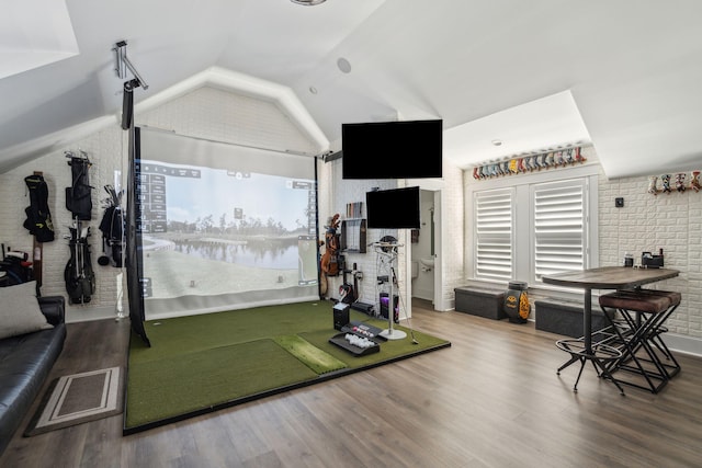 3894 Sawyers Island Dr, Mount Pleasant, SC 29466 - workout area featuring plenty of natural light, brick wall, vaulted ceiling, and wood finished floors