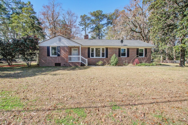 single story home featuring brick siding, crawl space, a chimney, and a front yard