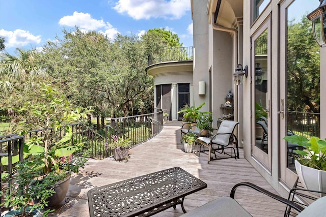 view of patio featuring a balcony