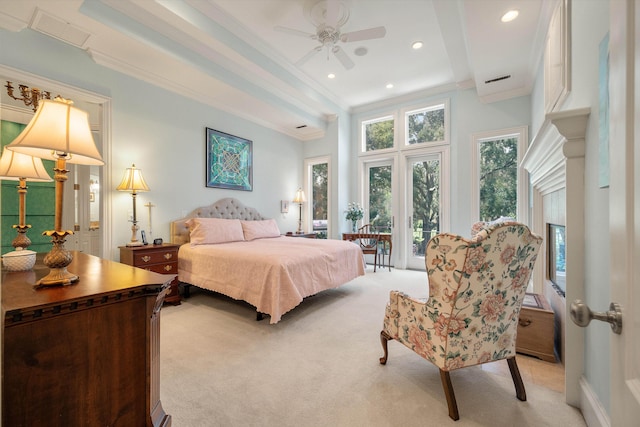 carpeted bedroom with ceiling fan and crown molding