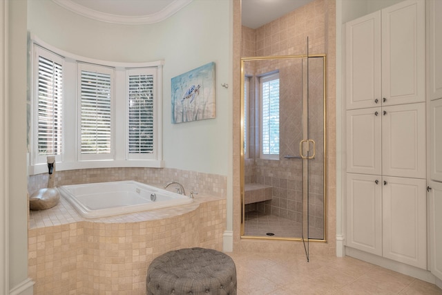 bathroom with tile patterned flooring and independent shower and bath