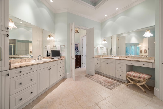 bathroom featuring a high ceiling, tile patterned floors, crown molding, a shower with door, and vanity