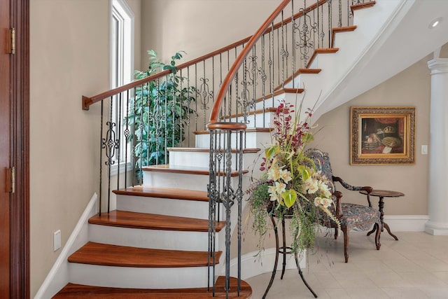 staircase with decorative columns