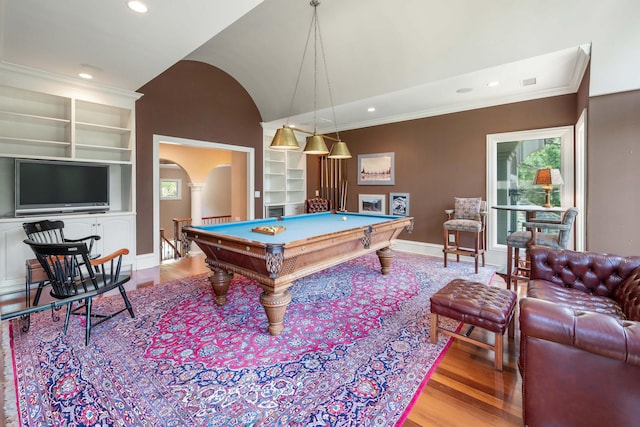 game room with crown molding, vaulted ceiling, built in shelves, pool table, and light hardwood / wood-style floors