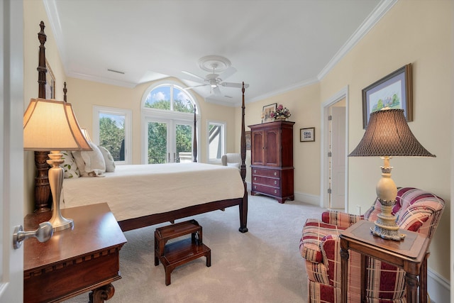 carpeted bedroom featuring ceiling fan, crown molding, and french doors