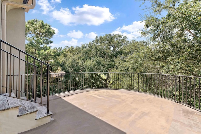 view of patio featuring a balcony