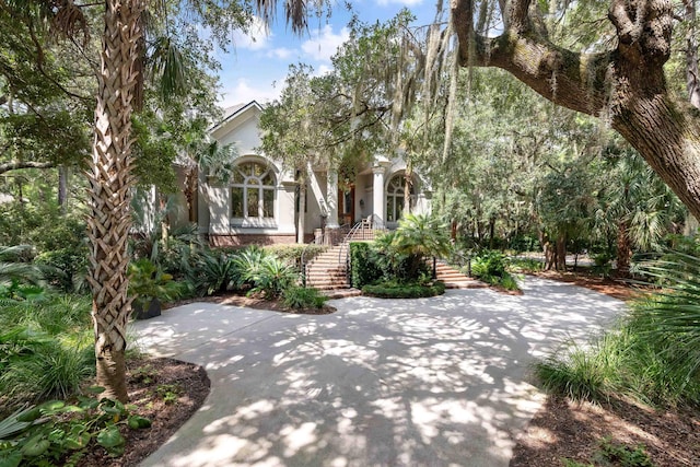 view of property hidden behind natural elements