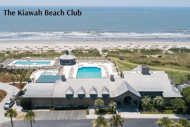 aerial view with a water view and a view of the beach