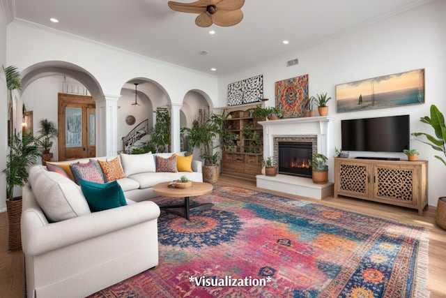 living room with ceiling fan, light hardwood / wood-style flooring, and ornamental molding