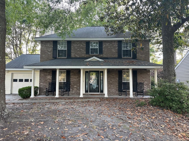 529 Laurel Ridge Rd, North Charleston, SC 29418 - view of front of home with covered porch, a garage, and brick siding
