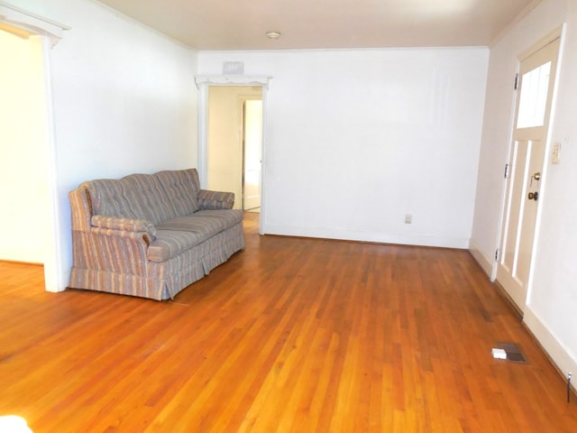 living area with hardwood / wood-style floors