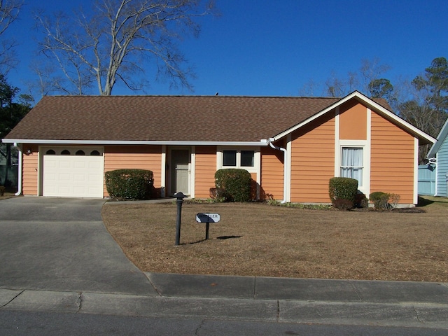 single story home with a front lawn and a garage