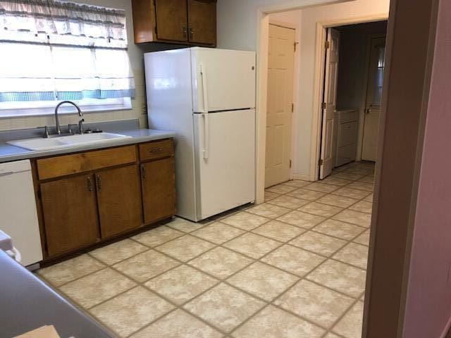 kitchen with sink and white appliances