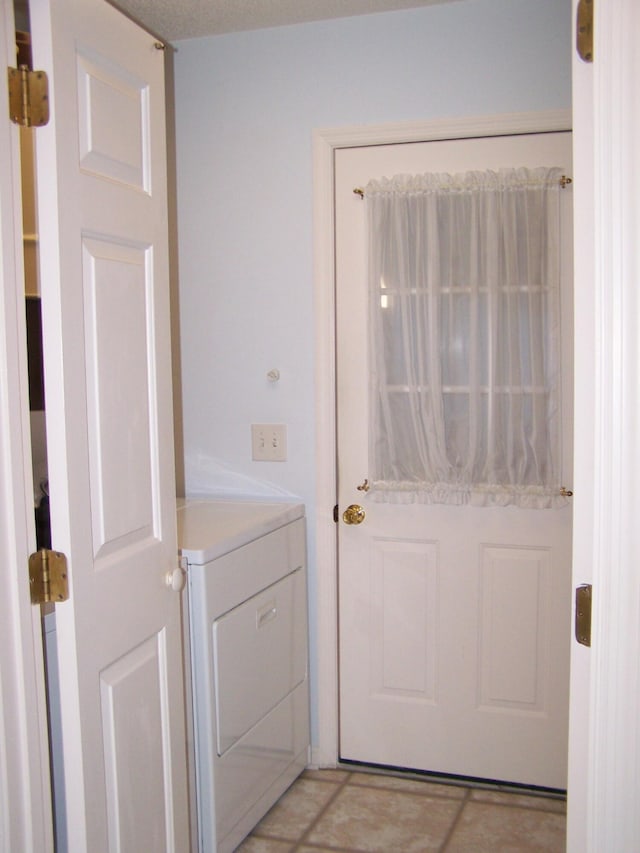 doorway to outside with washer / clothes dryer