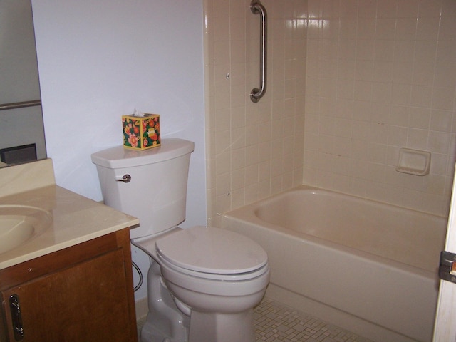 full bathroom with toilet, vanity, tiled shower / bath combo, and tile patterned floors