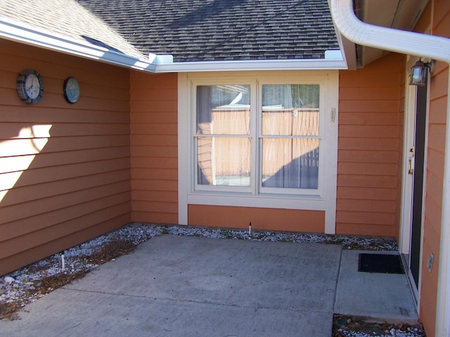 entrance to property with a patio area