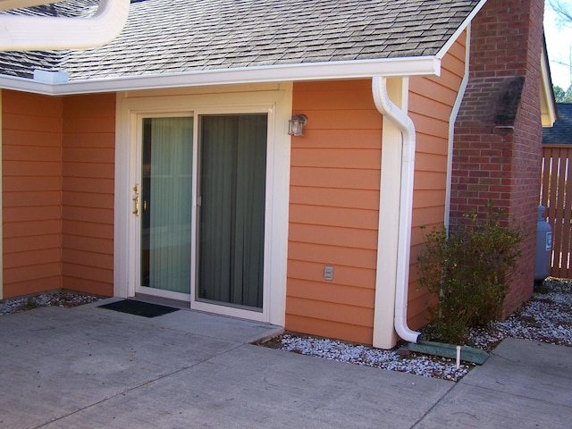 entrance to property with a patio area